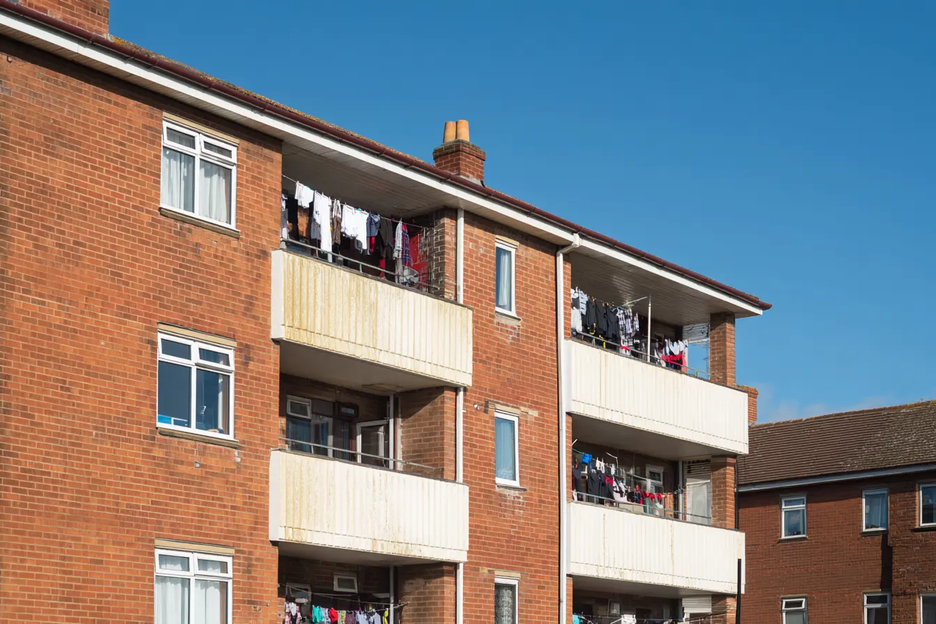Council flats with clothes hanging on balcony