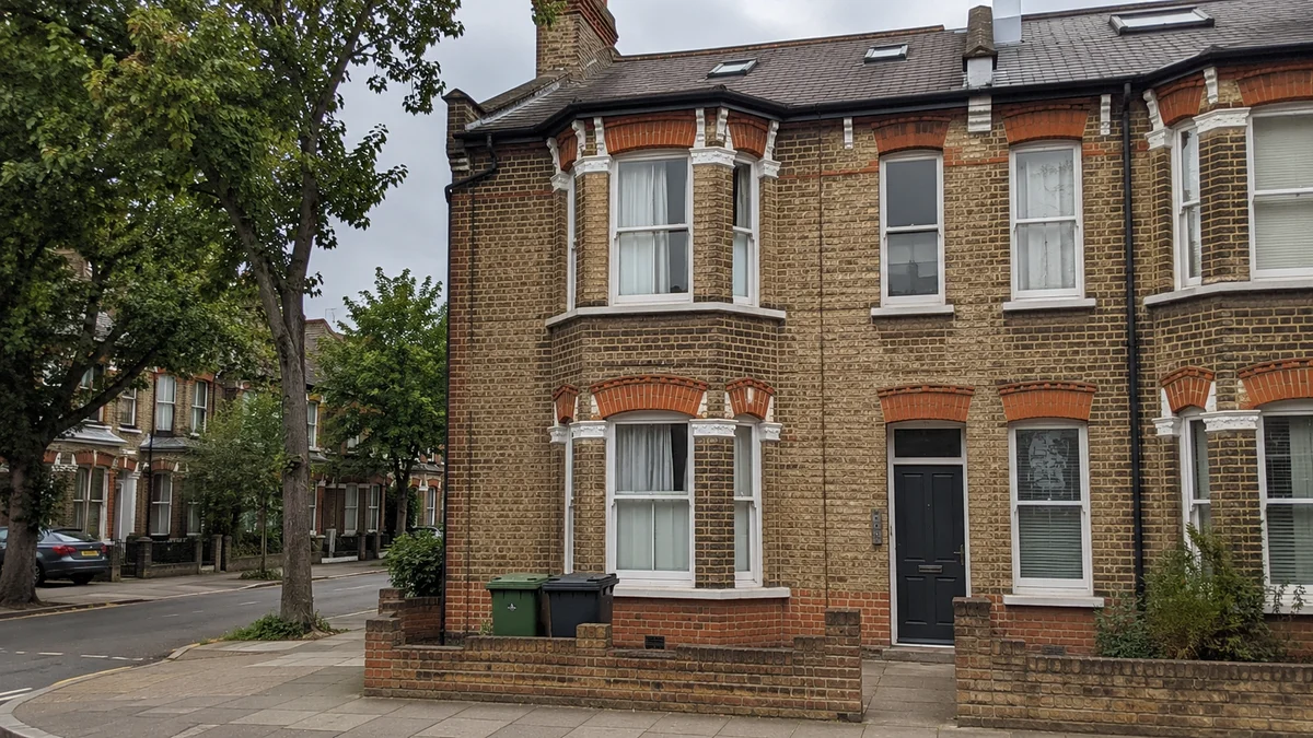 Victorian terraced houses in London converted into flats, with bay windows and yellow stock brick