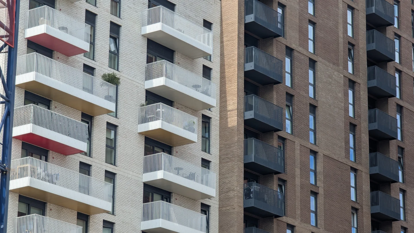 Two modern blocks of leasehold flats with balconies, side by side